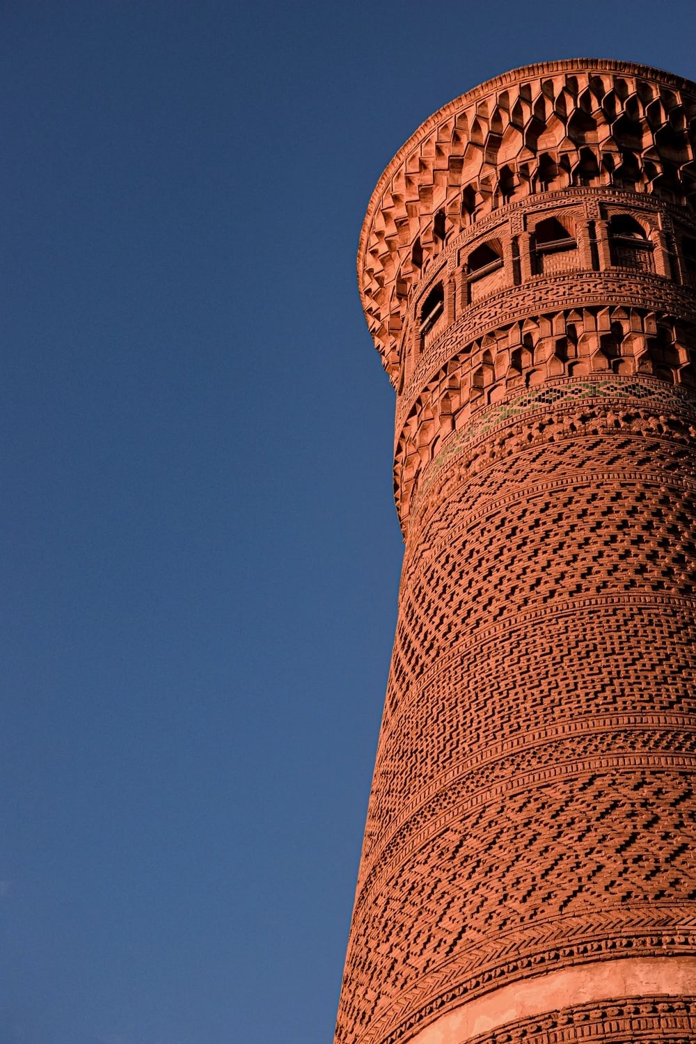 The Kalyan Minaret's rotunda gallery in Bukhara at sunset